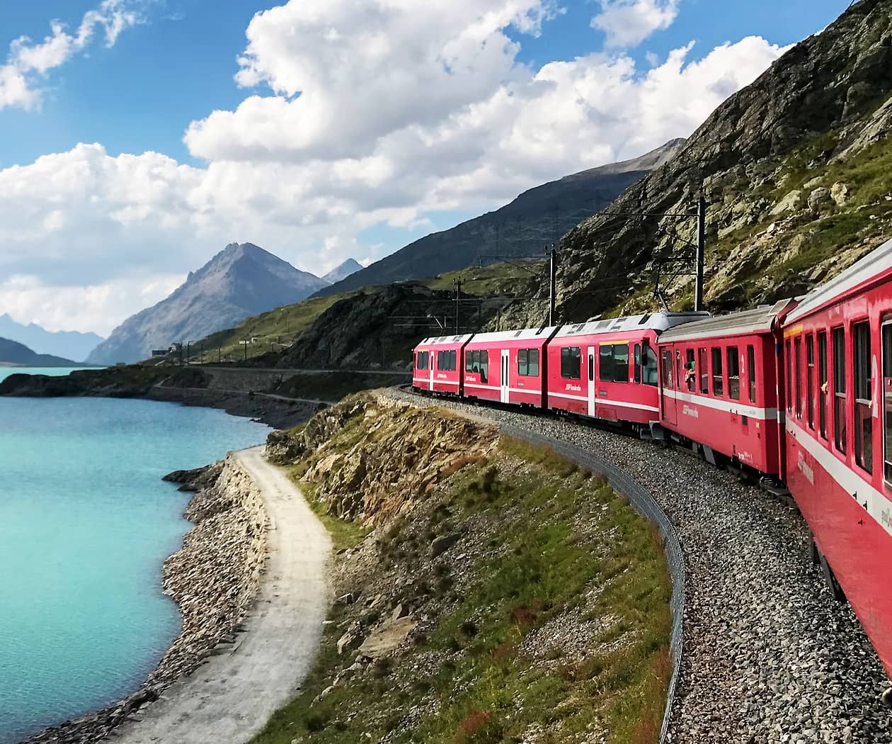 Train Traveling through Swiss Alps Train Traveling through Swiss Alps